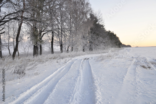 Beautiful winter road view. Winter road wallpaper. Snow Track Road. © bildlove