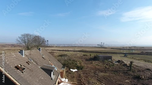 Aerial footage of an abandoned house due to open-cast mining photo