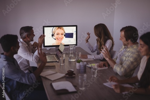 Business people talking to expert through video conference