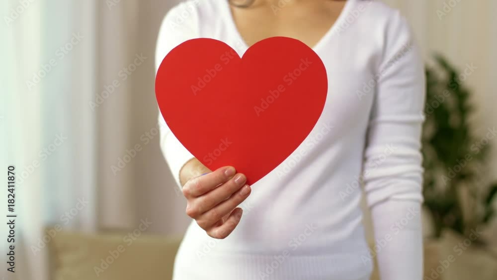 woman with heart and gay pride awareness ribbon woman with heart and gay pride awareness ribbon