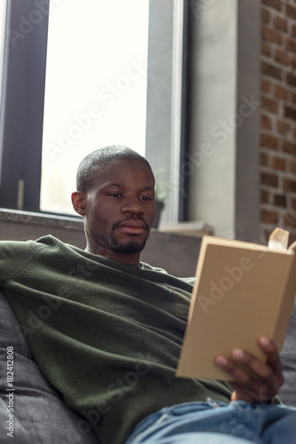 african american man reading book