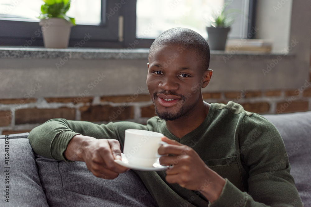 african american man holding cup african american man holding cup
