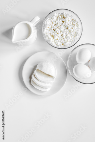 monochrome concept with dairy products on white table top view m