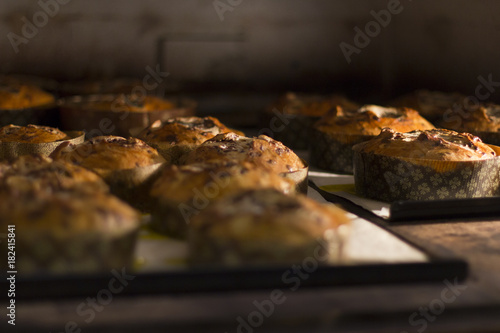 Italian christmas cakes known as panettone, baking inside a commercial oven