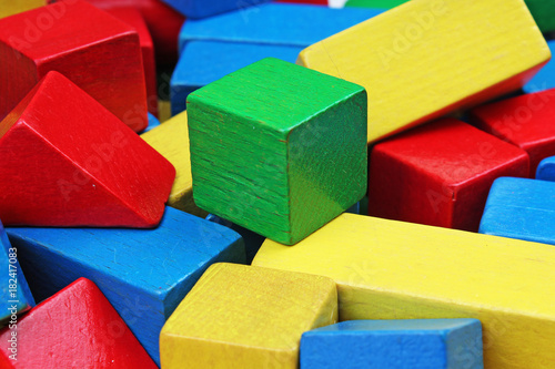 Wooden toy block background. Red, Blue, Yellow Green Wooden toy blocks on white background. Wood block texture pattern.