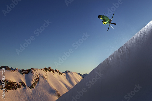 Freestyle skier jumping in a halfpipe, Nebelhorn, Allgau Alps, Bavaria, Germany