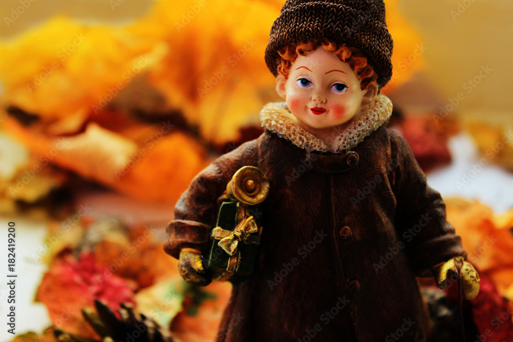 Small girl with Christmas presents makes a conversion from autumn to winter concept Small girl with Christmas presents makes a conversion from autumn to winter concept