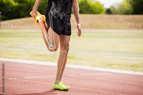 Cuadro en lienzo Highlighted bones of athlete man stretching on race track