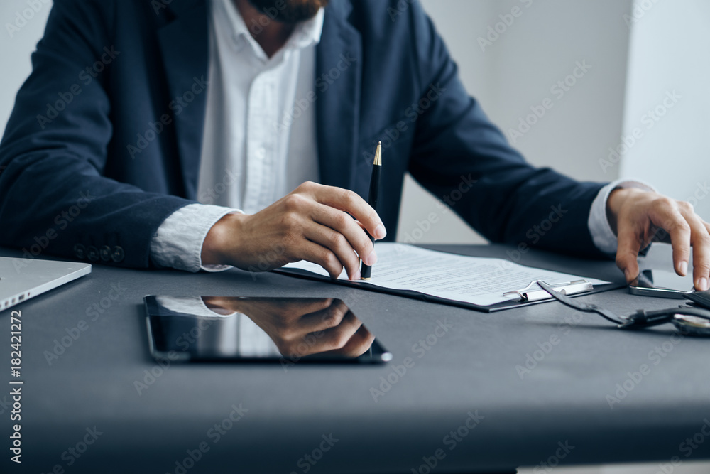 Business man working with documents at office desk in office Business man working with documents at office desk in office