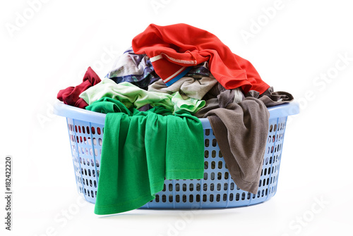 Clothes in a laundry basket isolated on white background