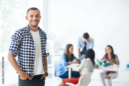 Successful businessman in front of diverse business team
