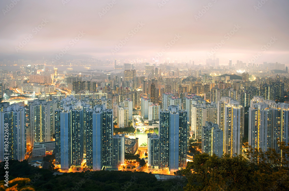 Illuminated city at dusk, Hong Kong, China Illuminated city at dusk, Hong Kong, China