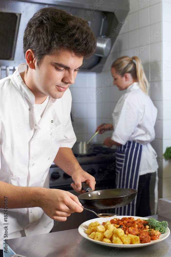 Chef Working In Restaurant Kitchen Chef Working In Restaurant Kitchen