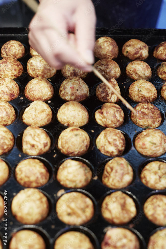 Takoyaki (dough balls filled with octopus), Osaka, Japan Stock Photo