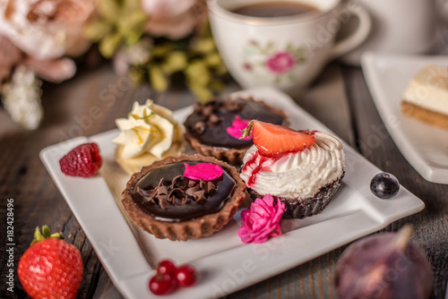 close up of colourful cake selection  photo