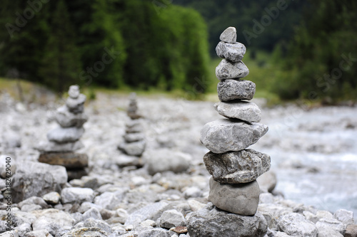 Stone cairns near the river at Hinterriss Eng, Karwendel mountains, Tyrolese limestone alps, Tirol, Austria photo
