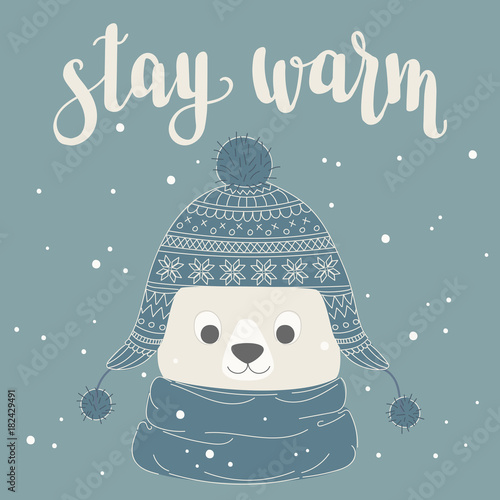Polar bear in a warm hat and scarf