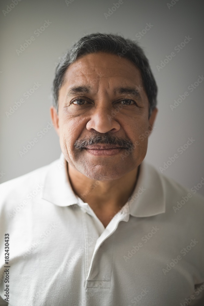 Portrait of serious man against wall Portrait of serious man against wall