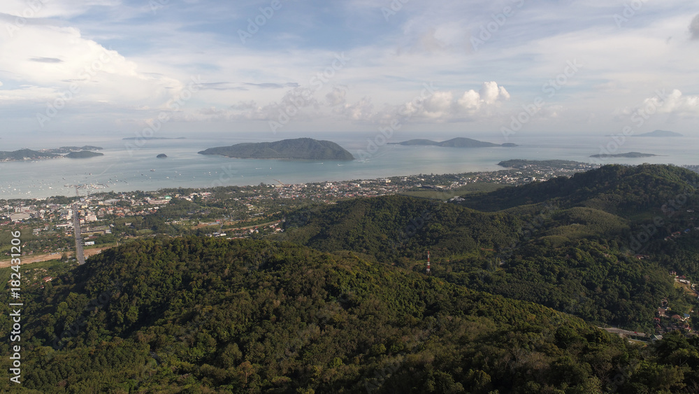 Ascending aerial drone shot over Phuket Hills and beaches, Thailand