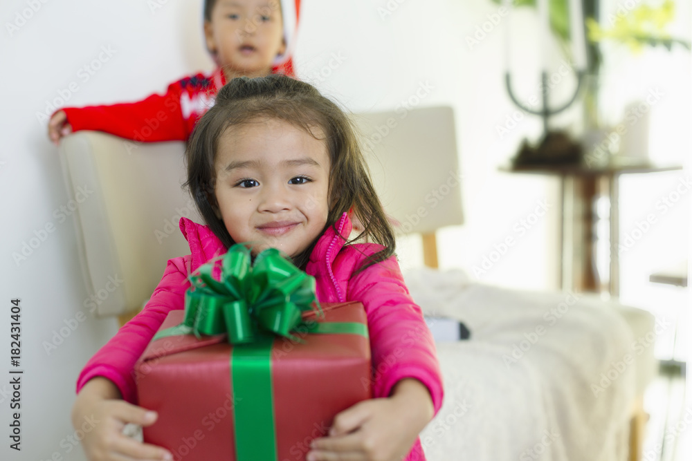 Cute girl holding gift boxes and smiling brightly. Cute girl holding gift boxes and smiling brightly.