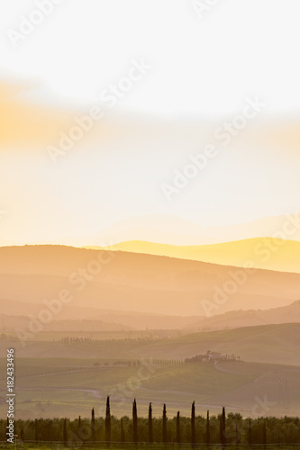 Sunset in a rolling rural landscape
