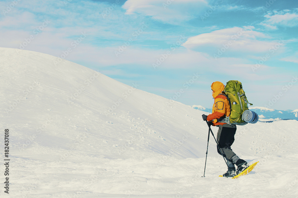 Winter hike in the mountains with a backpack and tent. Winter hike in the mountains with a backpack and tent.