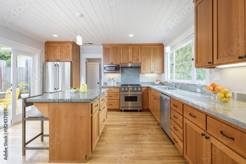 Custom designed wooden kitchen with gorgeous granite counter tops and kitchen island