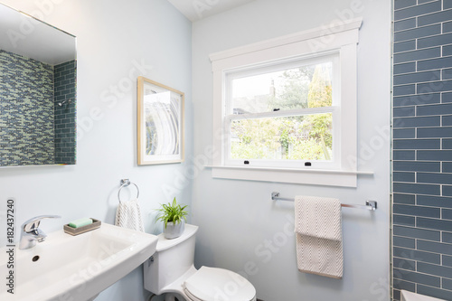 Modern bathroom with soft blue Mosaic glass tiles. 