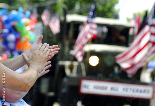 hands clapping veterans parade American flag patriotism photo