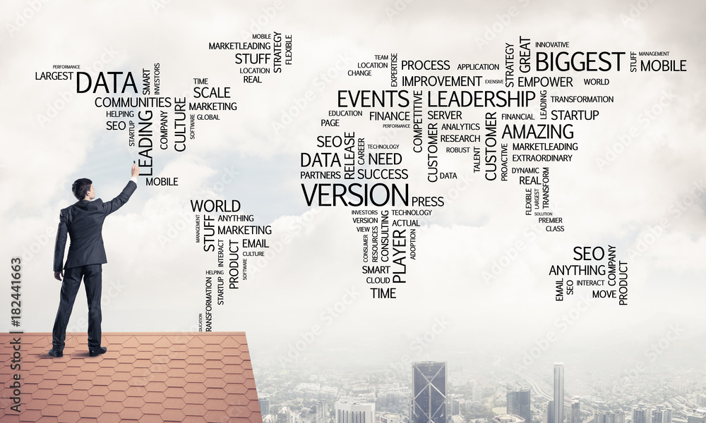 Businessman on brick roof draw world map as concept of globaliza Businessman on brick roof draw world map as concept of globaliza