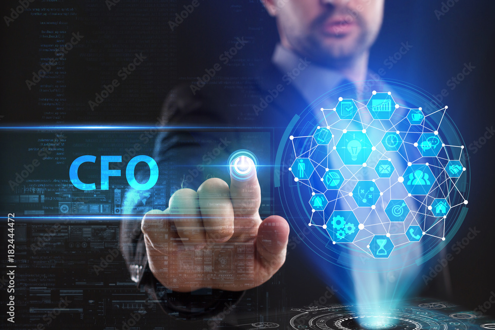 The concept of business, technology, the Internet and the network. A young entrepreneur working on a virtual screen of the future and sees the inscription: CFO The concept of business, technology, the Internet and the network. A young entrepreneur working on a virtual screen of the future and sees the inscription: CFO