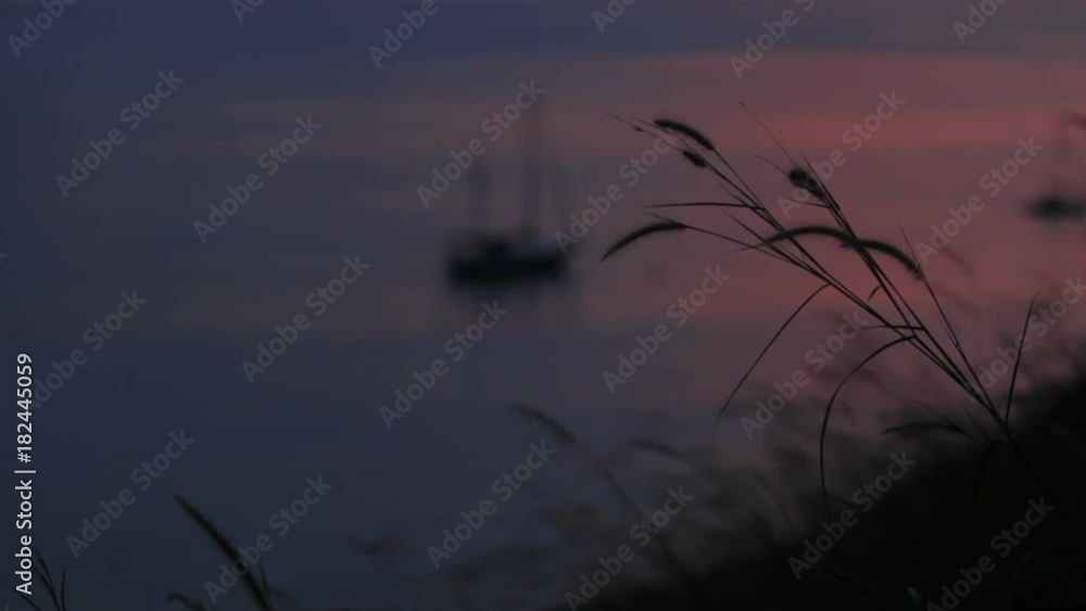 Sailing yacht sways on the waves. Cloudscape on sunset background. Phuket island, Thailand. Sailing yacht sways on the waves. Cloudscape on sunset background. Phuket island, Thailand.
