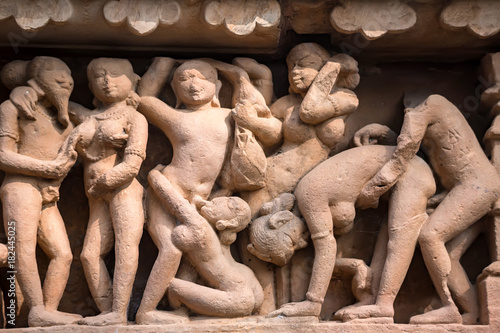 Close up erotic stone carving in Lakshman Temple photo