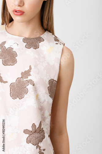 Young girl in the pink dress with floral print