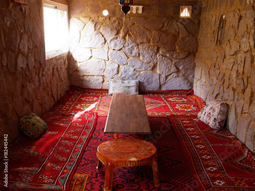 The Arab living tee room with sofas and pillows for the meetings, guests, tee discussions, tee time with decorated ceiling / the typical furniture in North Africa, Morocco, Fes, Marrakesh, Casablanca