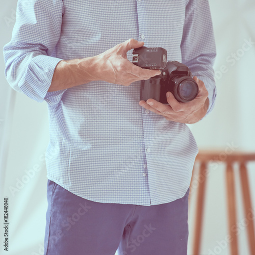 Man holding camera photo