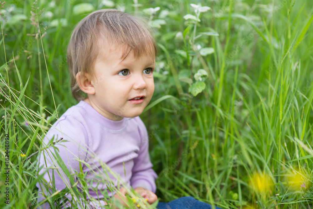 little girl of two years in the grass little girl of two years in the grass