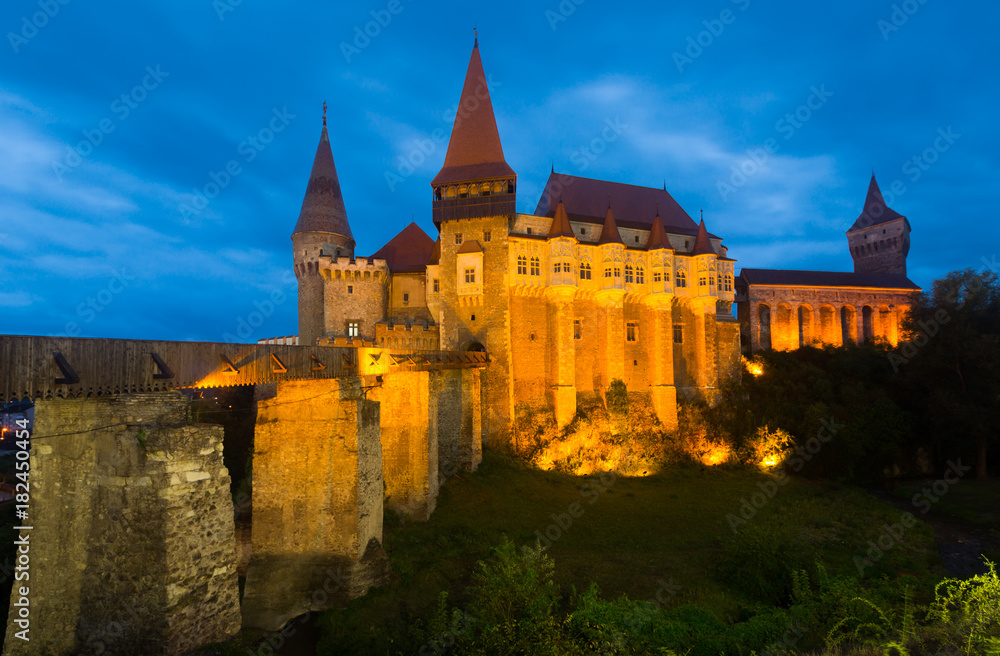 Night landscape with illuminated Corvin Castle, Romania