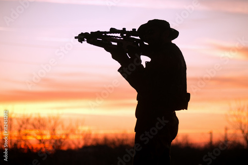 man with cross-bow silhouette