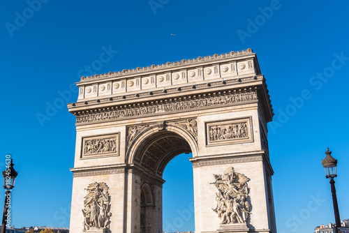 Paris, Arc de Triomphe in blue sky, beautiful monument with a plane above   © Pascale Gueret