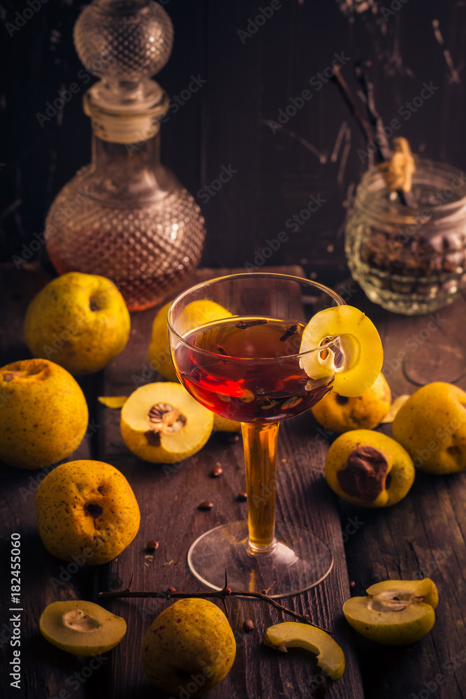 Tincture cup fruit quince wooden table Tincture cup fruit quince wooden table