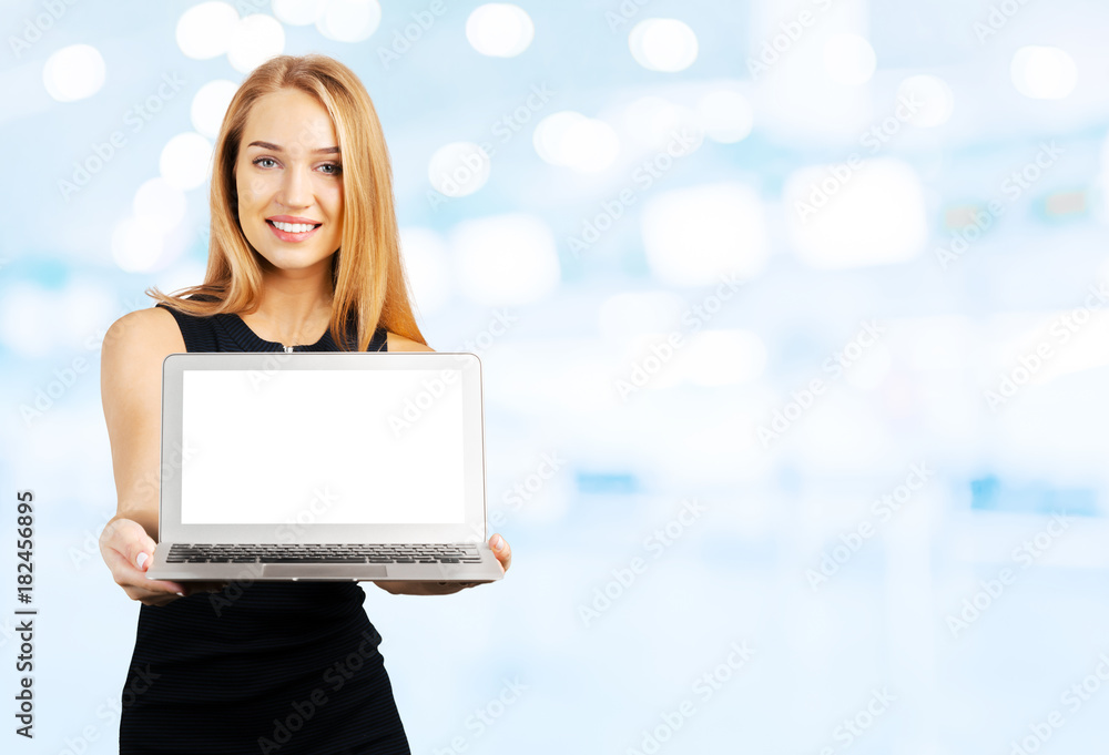 Young cheerful smiling businesswoman holds laptop Young cheerful smiling businesswoman holds laptop
