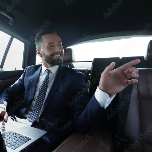 Confident businessman talking in car