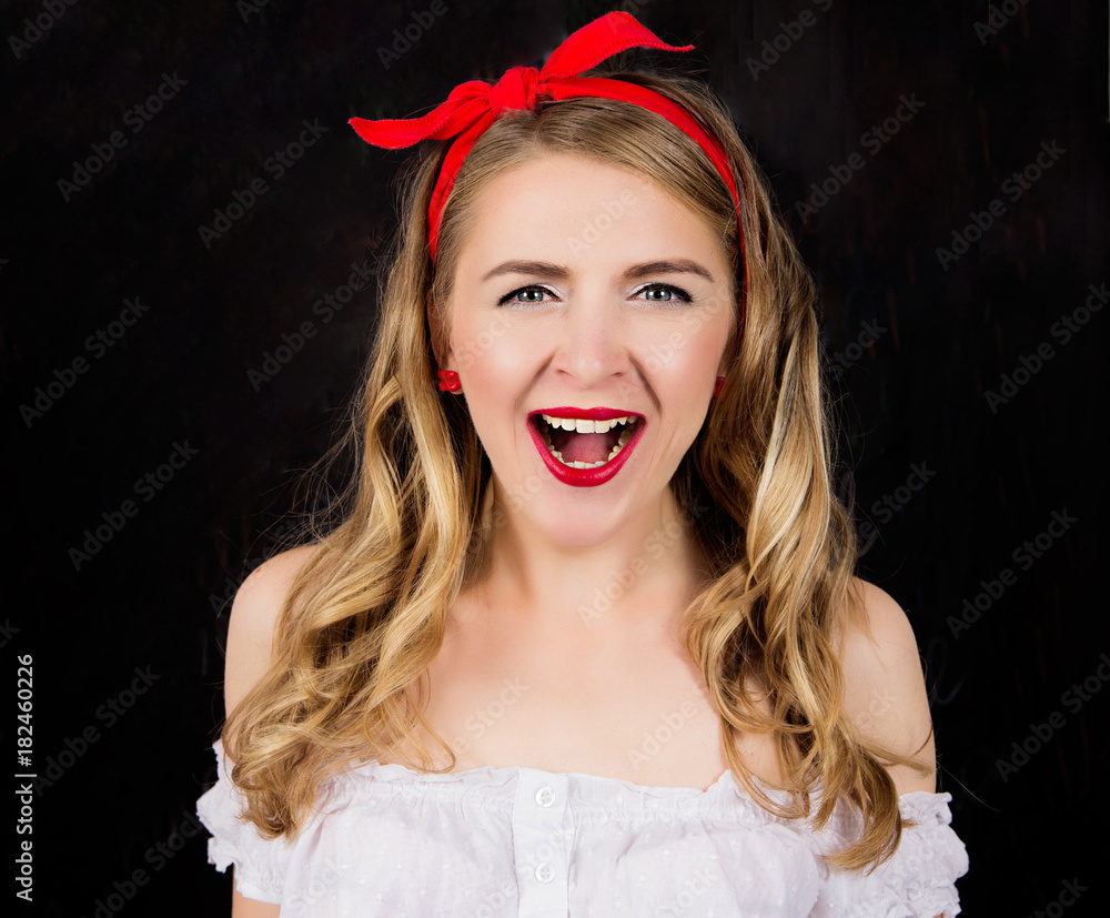A pin-up girl in shock and screams A pin-up girl in shock and screams