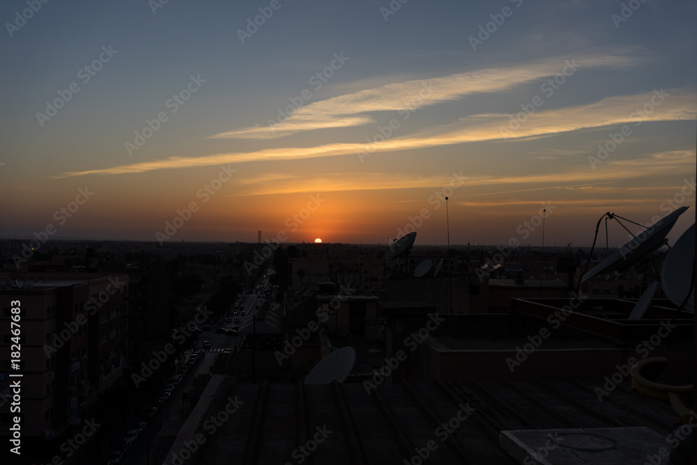 sunset in marrakesh morocco viewed from rooftop