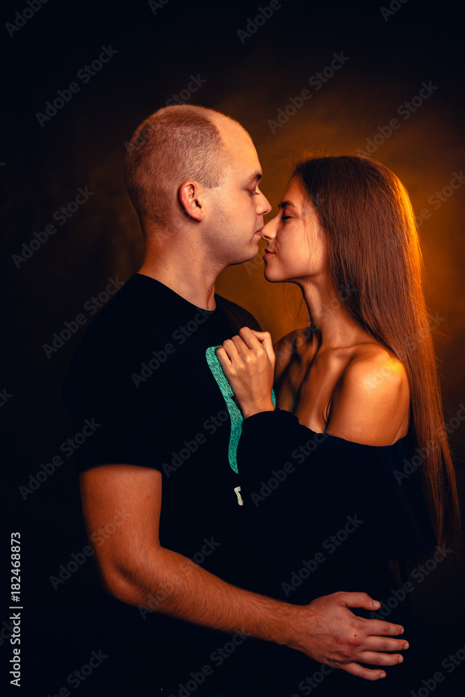 Girl and boy on the background of a sunset color Girl and boy on the background of a sunset color