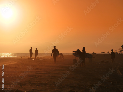 Golden hour on the California beach  surfers  photographers  people