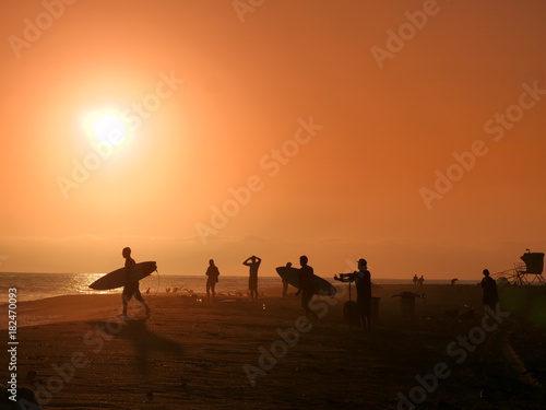 Golden hour on the California beach, surfers, photographers, people © Tatiana