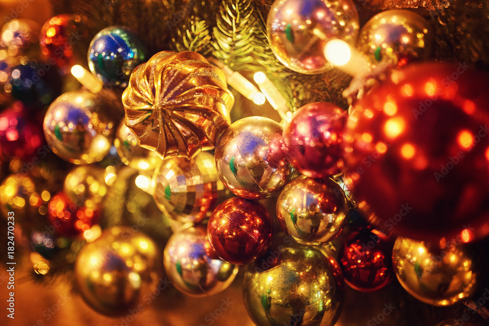 the New Year tree on the city square is decorated with beautiful spheres and garlands the New Year tree on the city square is decorated with beautiful spheres and garlands