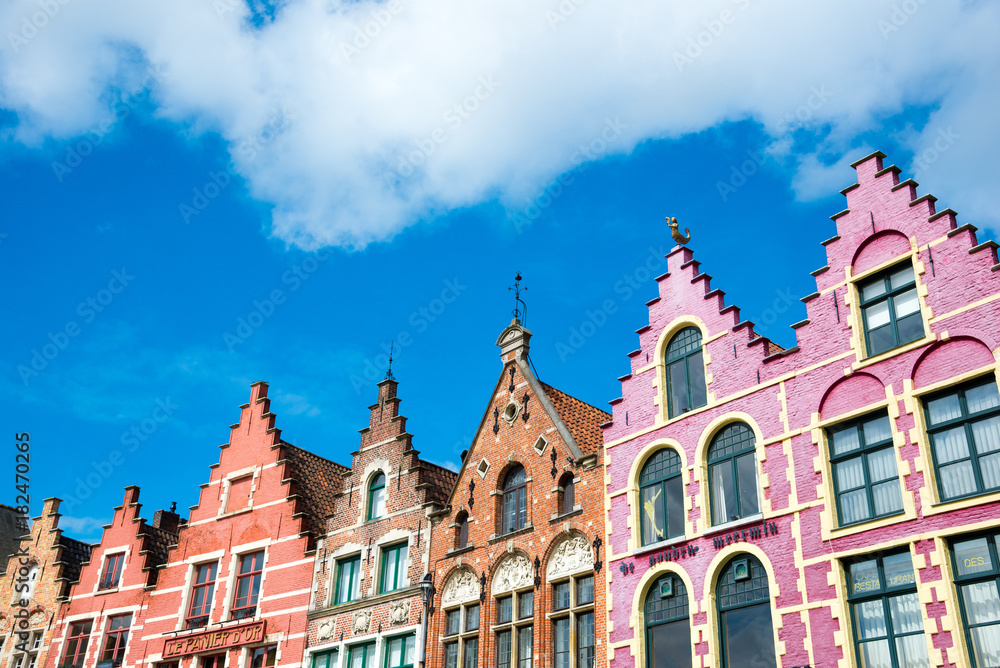 Colorful old brick houses in the Market Square in Old Town of Bruges, Belgium